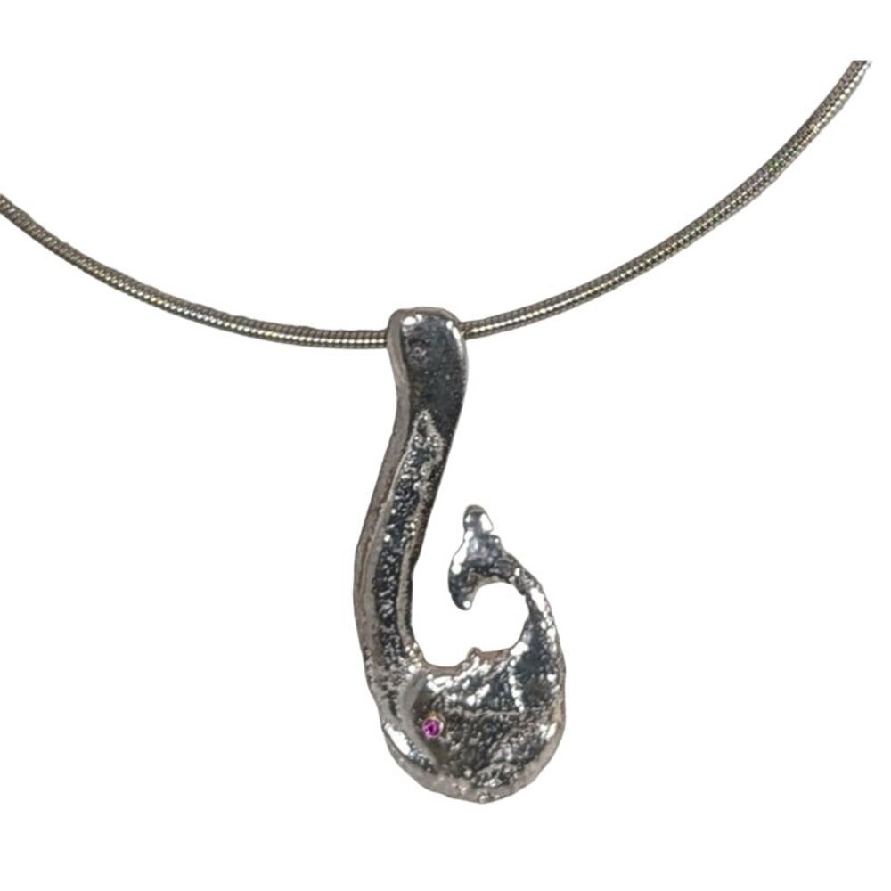 SS Hand cast Maori fish on 17"SP wire Pendant length2.25"Garnet eye.New Zealand